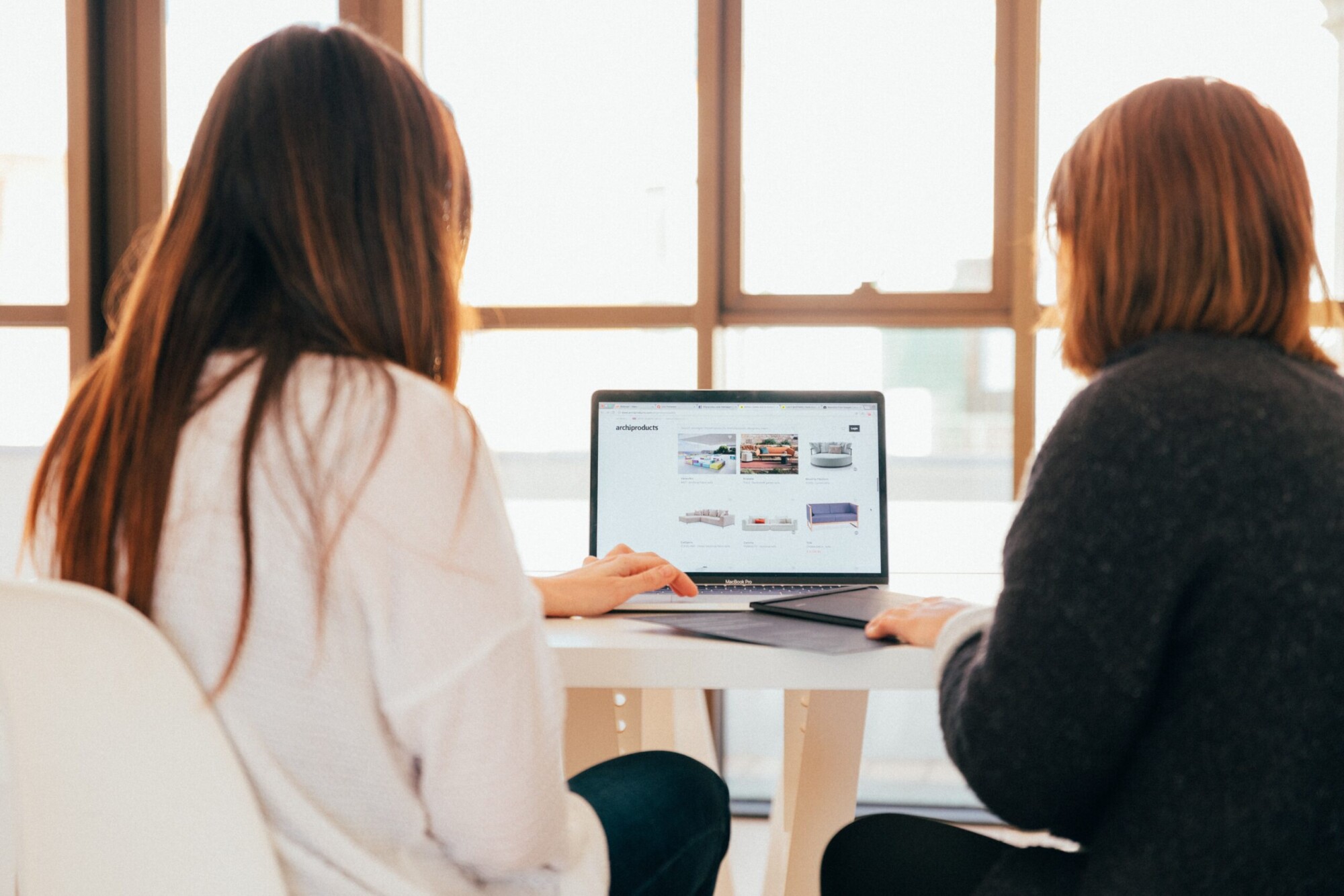 kobu-agency-7okkFhxrxNw-unsplash two women looking at sofas together