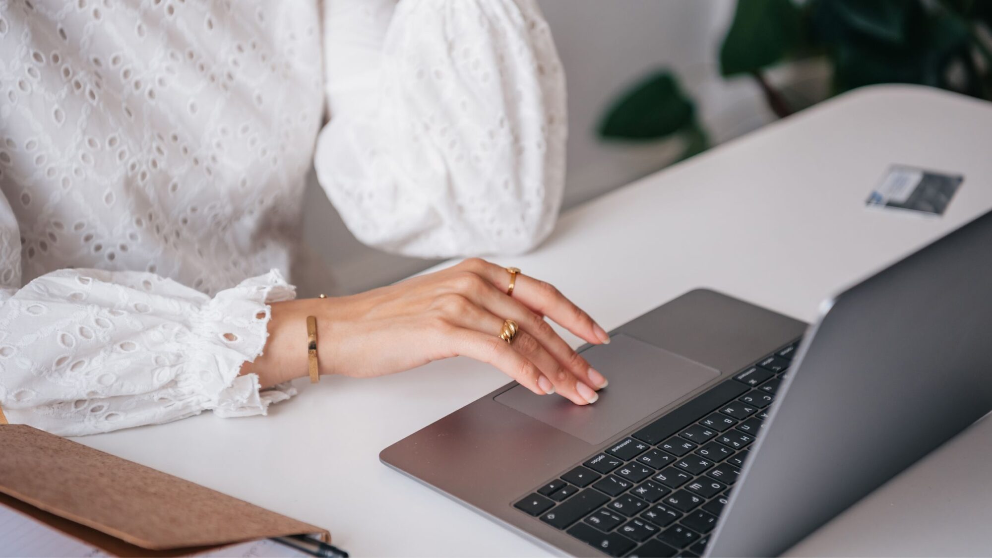 a woman writing on a keyboard