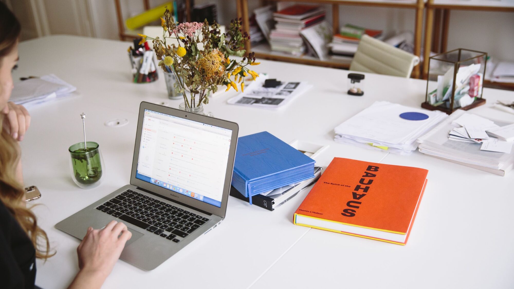 luke-southern-9yCYGgPe5Kg-unsplash a woman writing on a keyboard
